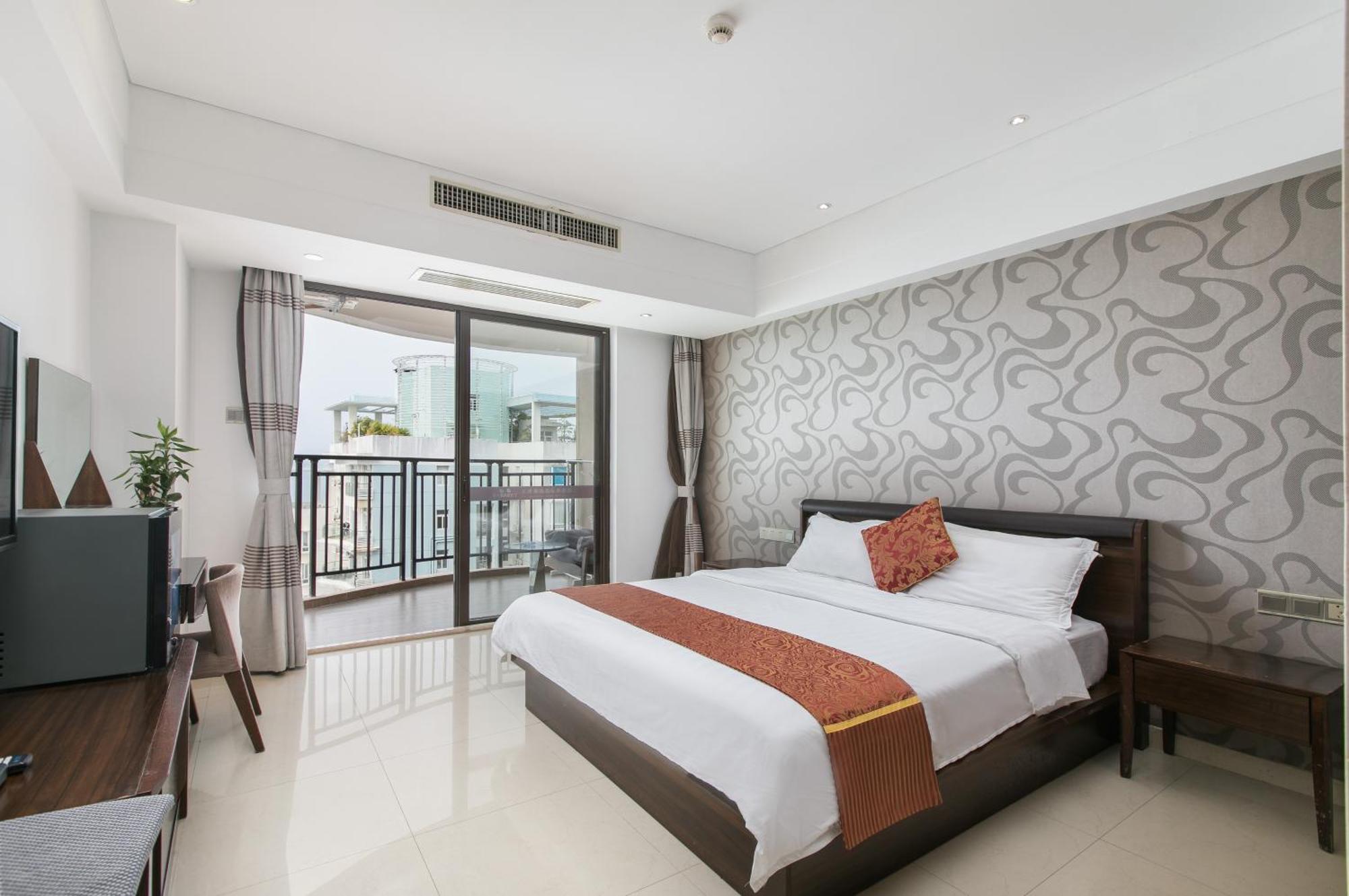 Апарт отель Sanya Sun And Sea Gueshouse Номер фото