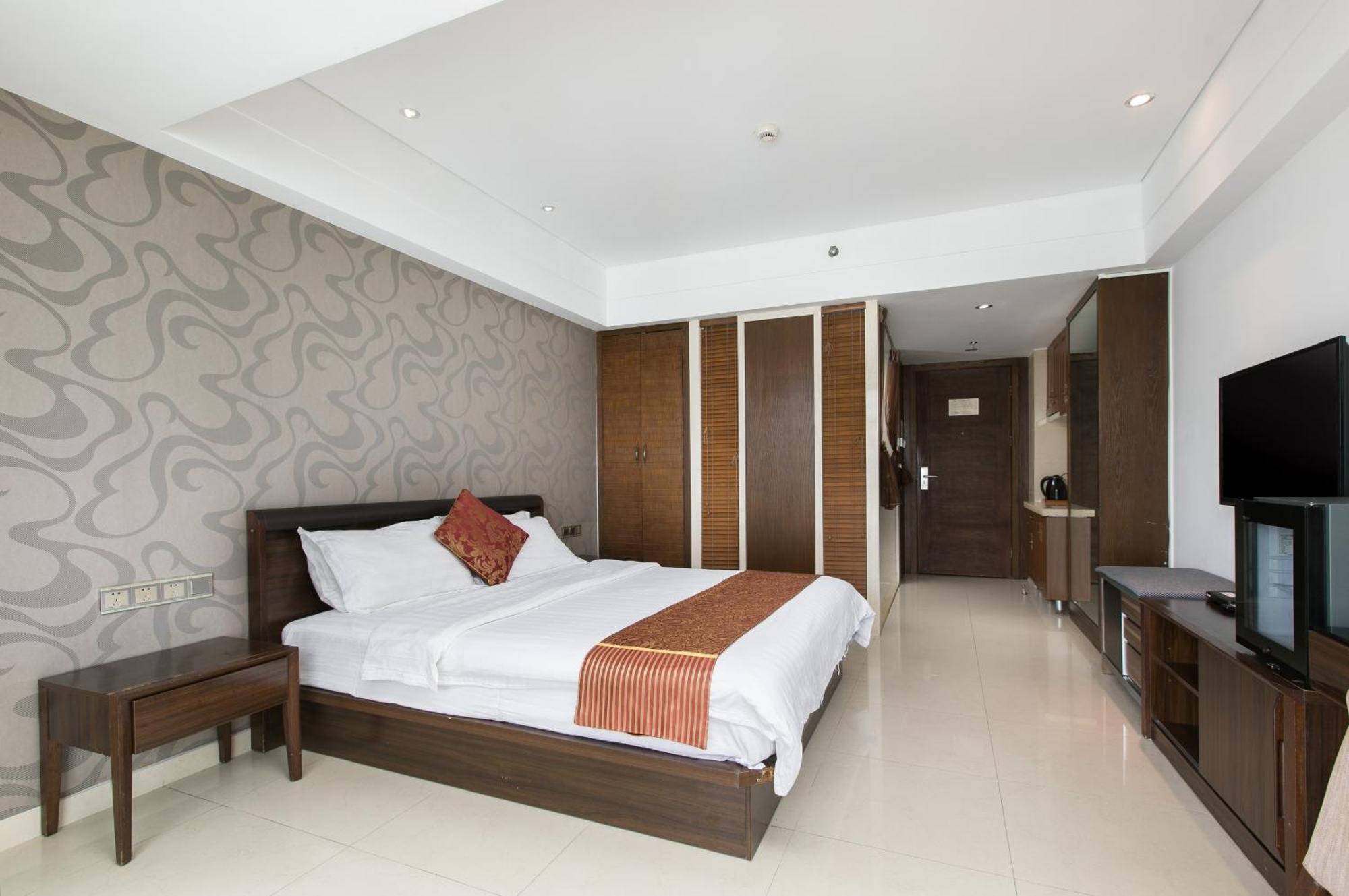 Апарт отель Sanya Sun And Sea Gueshouse Номер фото
