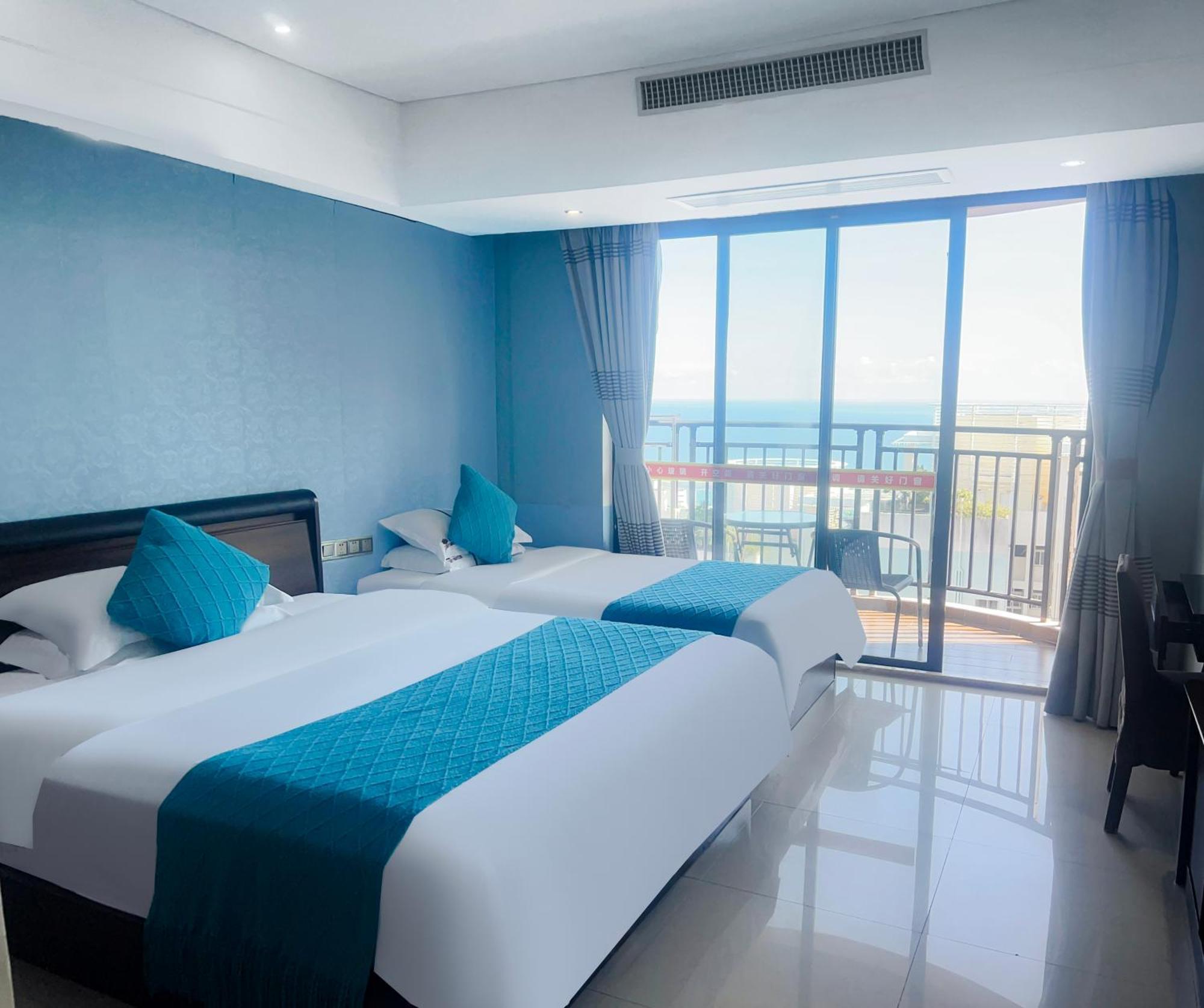 Апарт отель Sanya Sun And Sea Gueshouse Экстерьер фото