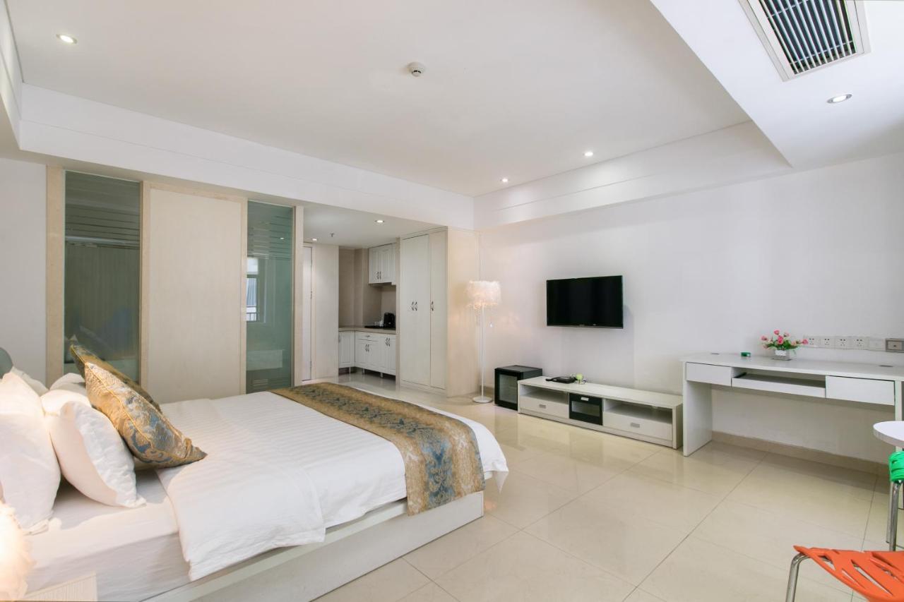 Апарт отель Sanya Sun And Sea Gueshouse Экстерьер фото