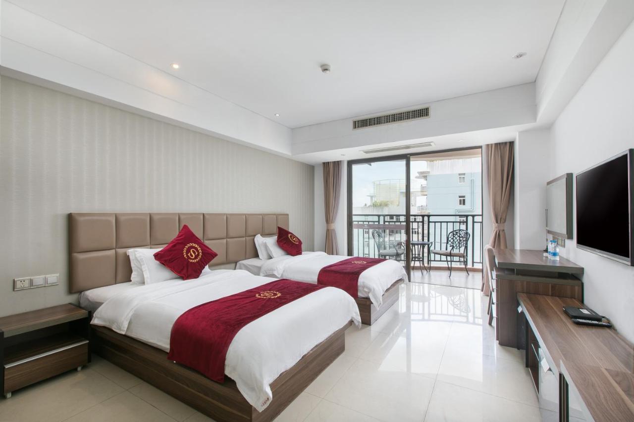 Апарт отель Sanya Sun And Sea Gueshouse Экстерьер фото
